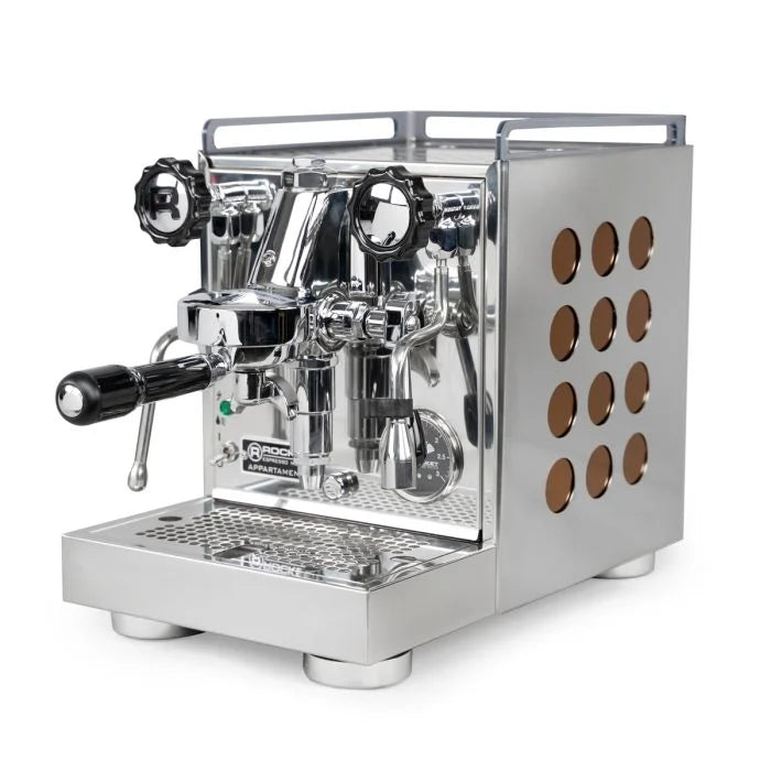 Side image of chrome Rocket Espresso Appartamento Espresso Machine with black handles and twelve brown dots